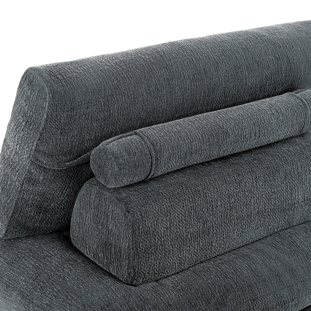 Close-up of the Korser grey fabric sofa, highlighting the soft cylindrical pillow and textured backrest.