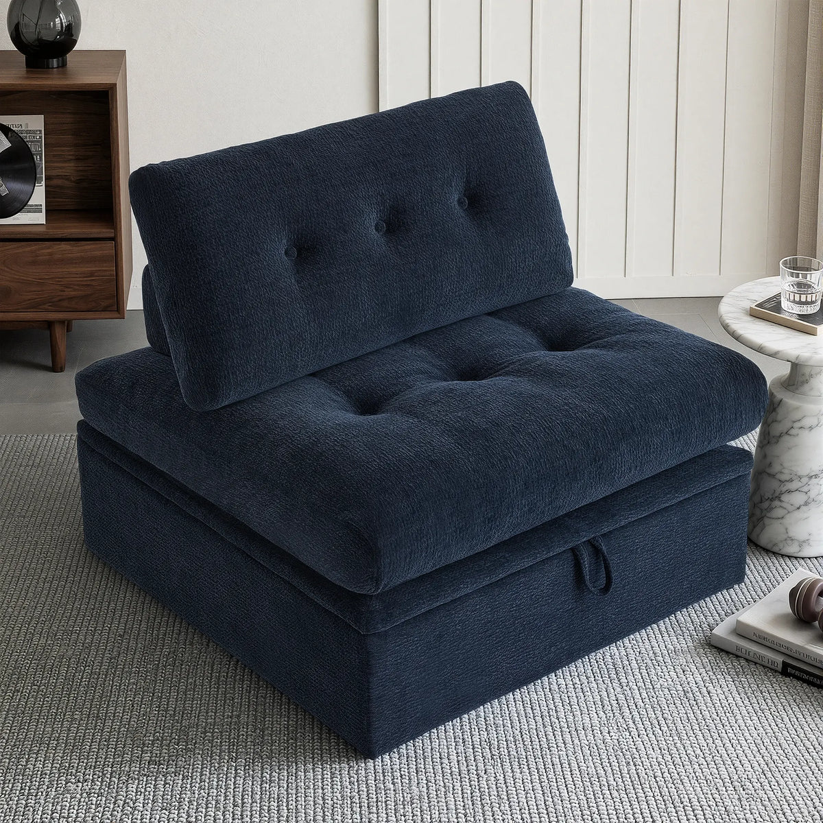A 3/4 side angle view showing the Korser navy blue 1-seater modular armless single sofa chair with backrest and storage.