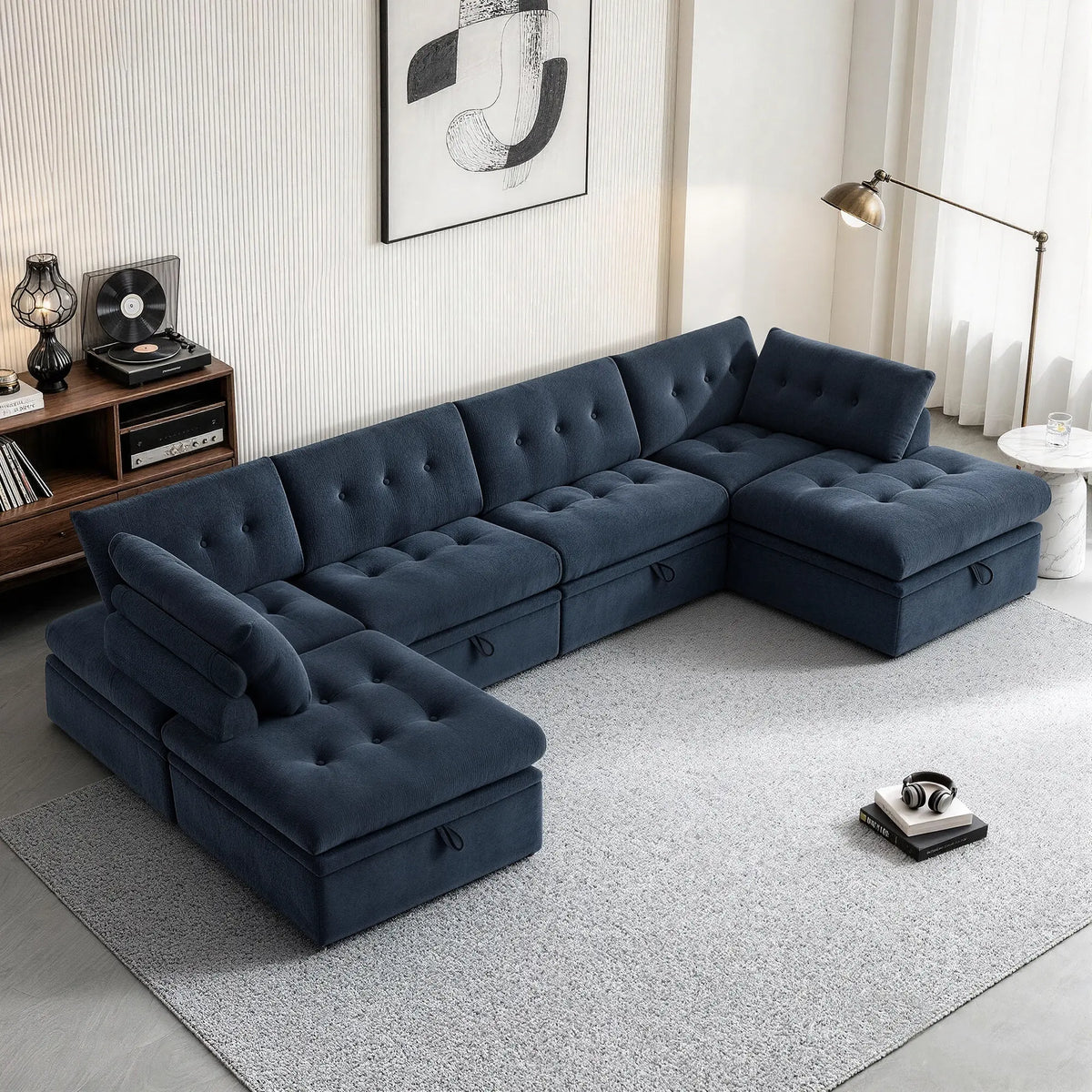 High-angle view of a Korser navy blue 6-seater U-shaped modular storage sectional sofa with backrests and ottoman.