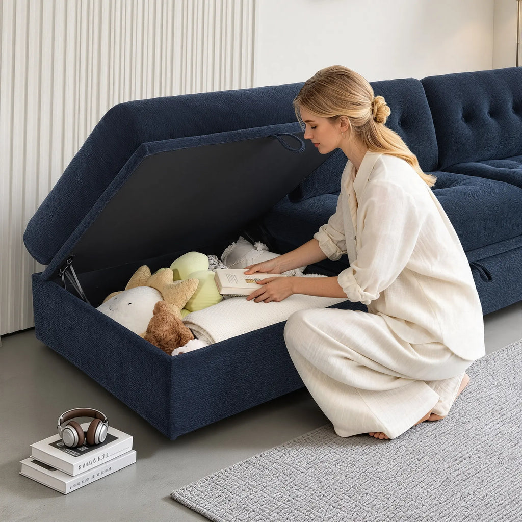 Close-up view showing the under-seat hidden storage function of a Korser navy blue modular sofa module.